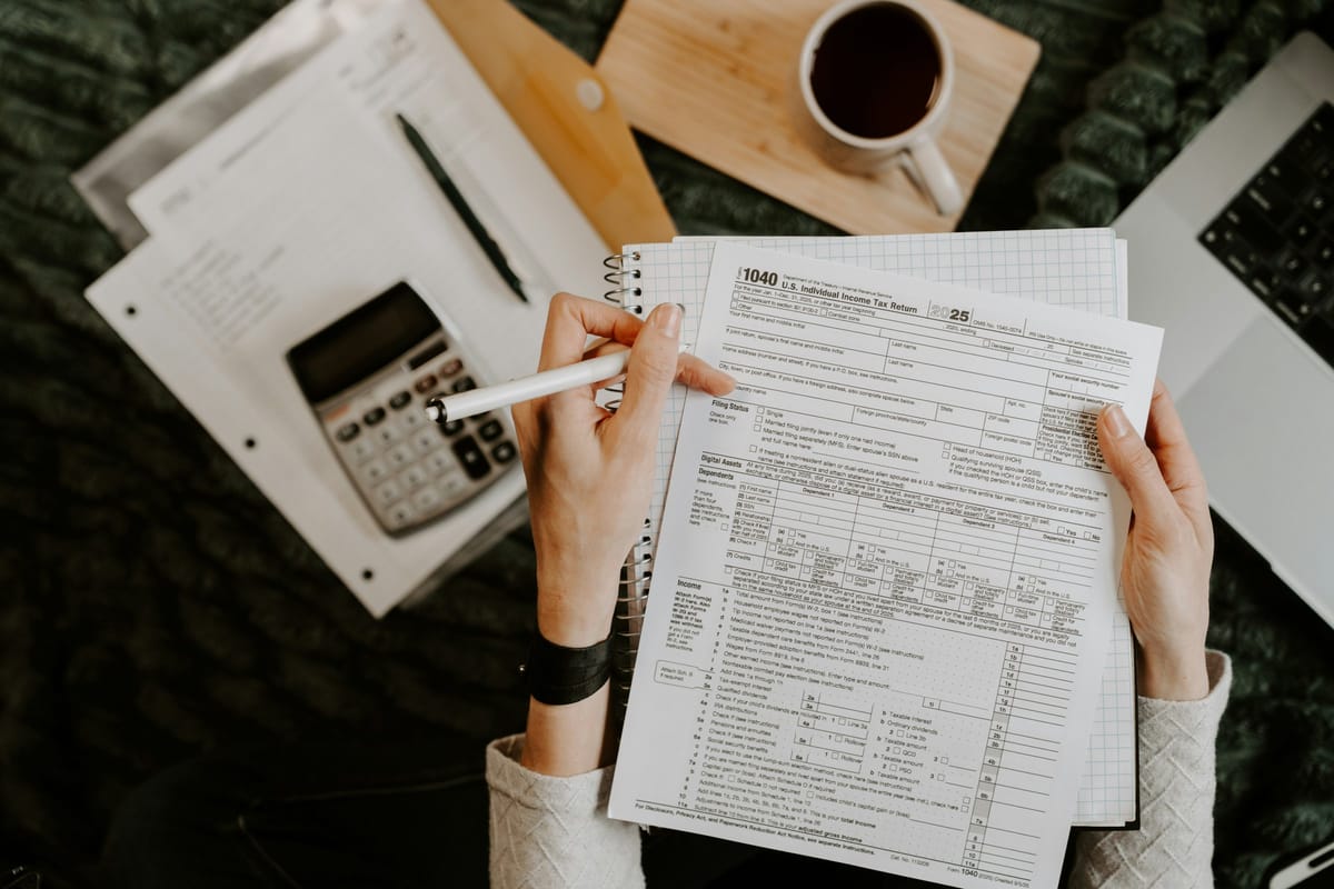 Documents and calculator on a desk for a Canadian business tax update
