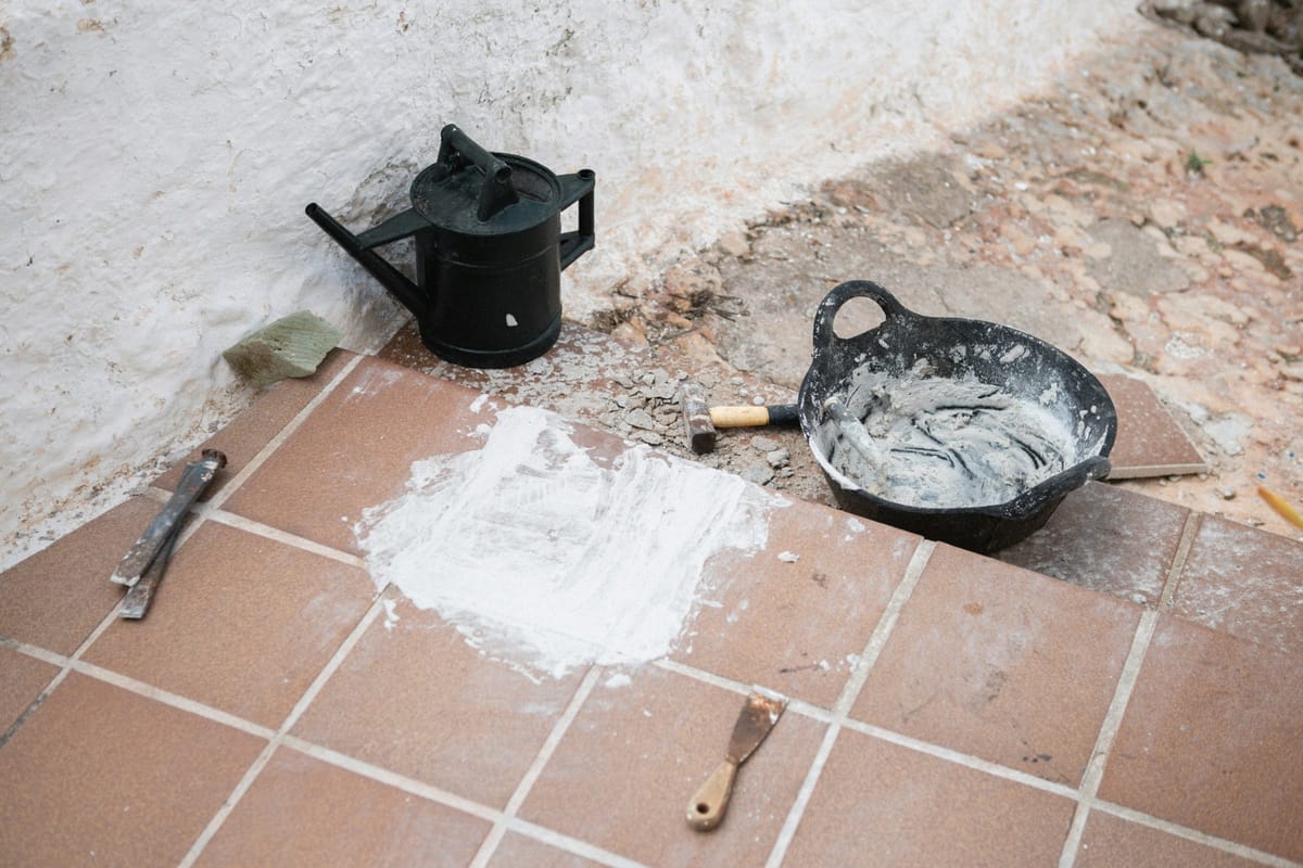 Renovation tools staged on a floor, clean practical home-care image