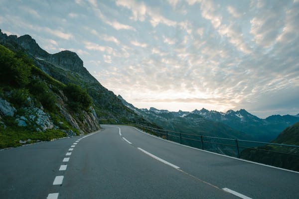 Car driving on a scenic mountain road